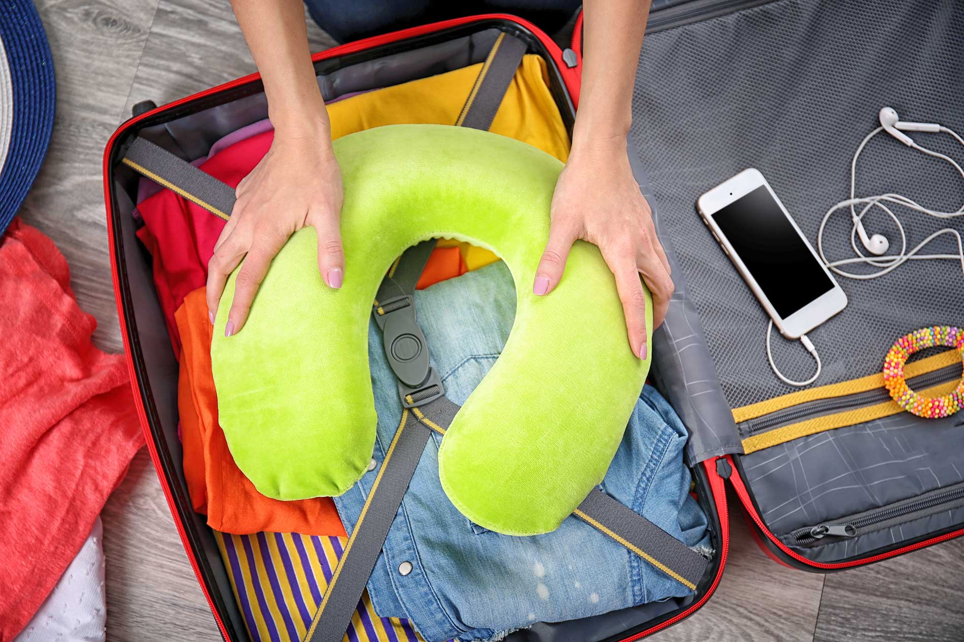 Packing a suitcase to prepare for travel